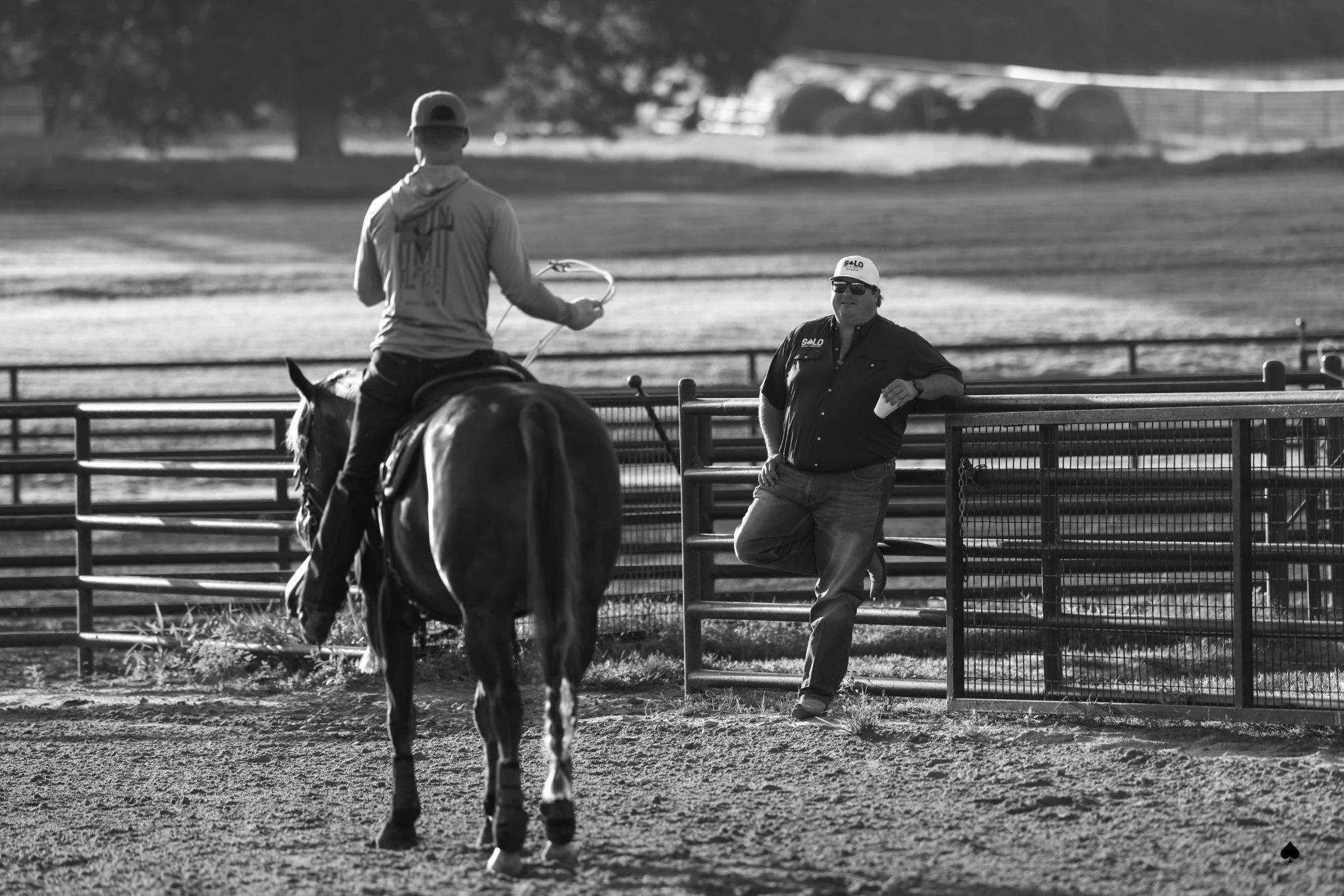 A Solo Select advisor talking with a roper in the arena